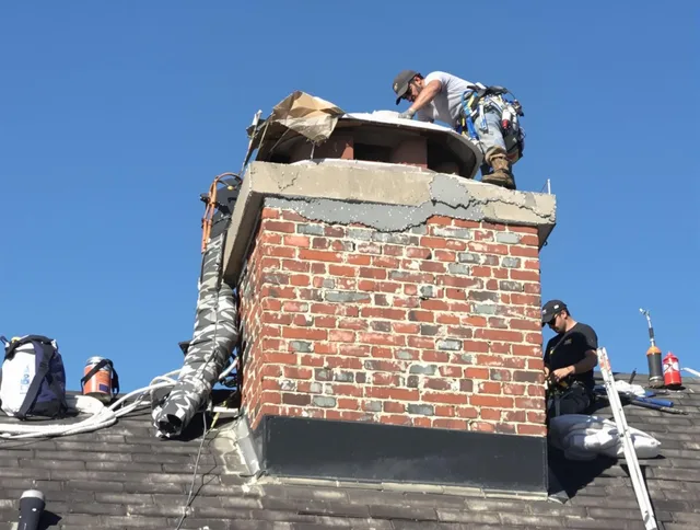 Winter Haven Chimney Sweep installing a custom chimney crown in Winter Haven, FL
