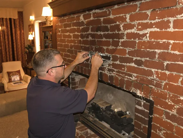 Winter Haven Chimney Sweep expert fixing a fireplace in Winter Haven, FL